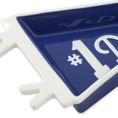 Pennant-shaped ceramic trinket tray with navy blue glaze and white "#1 Dad" message and tie-themed trim.


