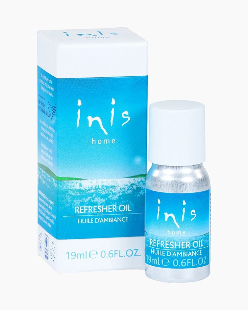 Small glass bottle of Inis concentrated refresher oil with ocean-blue label and white cap.