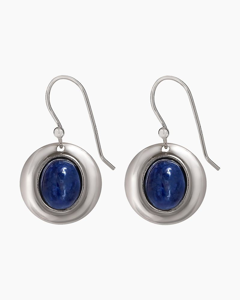 Drop earrings with deep blue sodalite stone framed in silver-toned metal, handcrafted in the USA.

