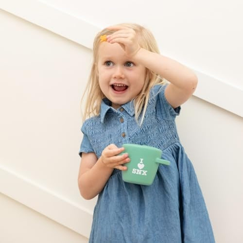 I Love SNX Happy Snacker silicone snack cup with snap-tight lid and easy-grip handles, designed for self-feeding.
