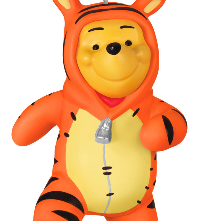 Winnie the Pooh ornament dressed in a striped orange Tigger costume with hood and bouncing pose