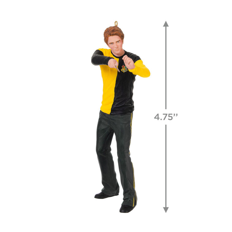 Cedric Diggory in yellow and black Hufflepuff robes raising his wand in a Harry Potter Christmas tree ornament