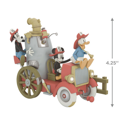 Mickey, Donald, and Goofy on a vintage fire engine ornament with light, sound, and motion from Mickey’s Fire Brigade.

