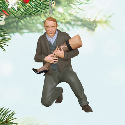 Hallmark Keepsake ornament of Old Man Parker kneeling and cradling broken leg lamp, A Christmas Story movie scene