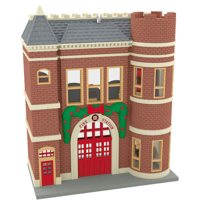 Red brick firehouse with festive garland, red door, and dalmatian dog, Hallmark Keepsake Korners Christmas ornament