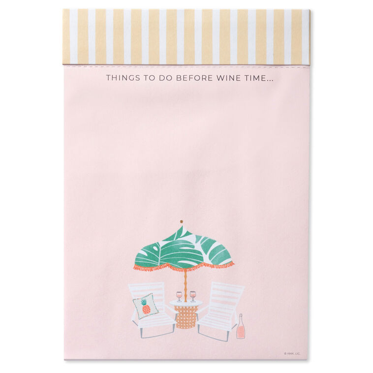 Pink to-do note pad with wine glasses, beach chairs, umbrella, and tropical leaf accents on a striped header.
