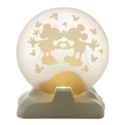 Light-up Mickey and Minnie figurine with heart hands silhouette on a frosted moon and “Over the moon” quote on the base.