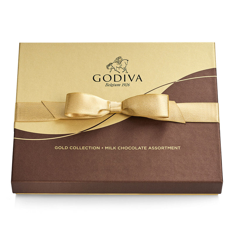 An 18-piece Godiva milk chocolate gift box tied with a gold ribbon, filled with silky smooth assorted chocolates in a variety of textures and flavors.

