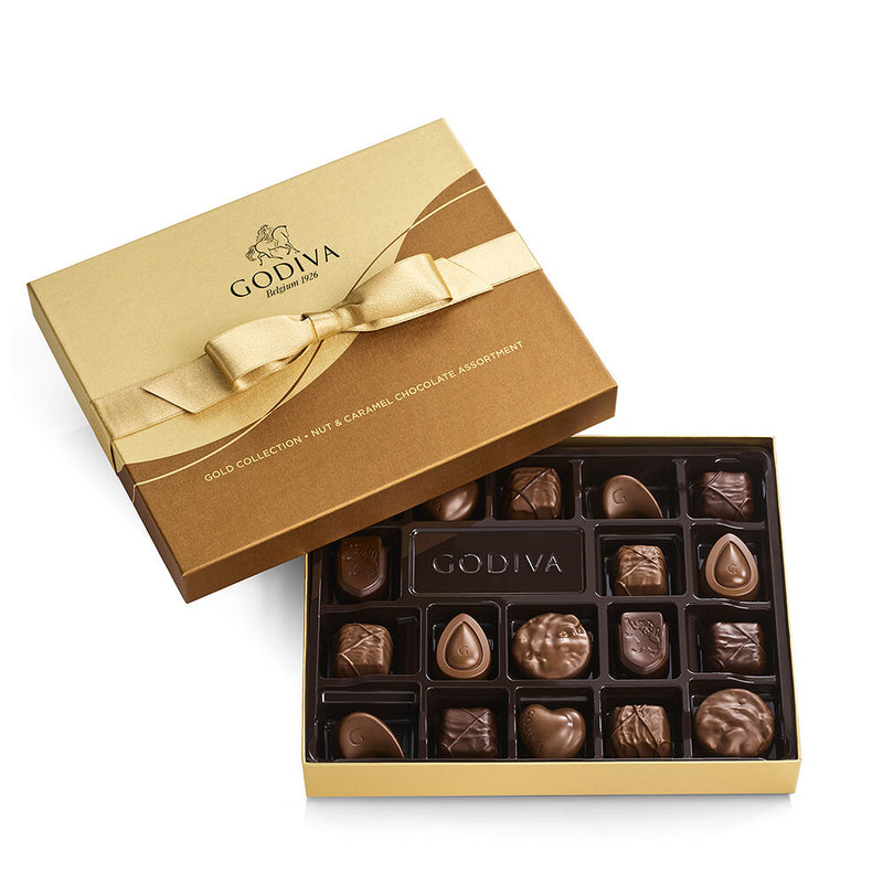 Discover crunchy nuts and luscious caramels in this 18-piece box of chocolates featuring mouthwatering milk and dark chocolate pieces. Chocolate lovers who crave crunchy nuts, creamy pralinés and luscious caramels will be overjoyed when you present them with this delectable chocolate gift—our Assorted Chocolate Nut and Caramel Gift Box featuring 18 gourmet chocolates in milk and dark chocolate that offer the ultimate chocolate experience for nut and caramel lovers.

Your friends and family will love receivi