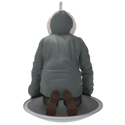 Hallmark Keepsake Mini National Lampoon’s Christmas Vacation Sledding Clark ornament—Clark in parka on saucer sled, startled expression, snowy hill