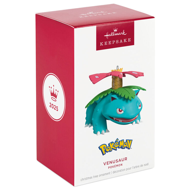 Hallmark Keepsake Pokémon Venusaur ornament with pink blossom on its back, blue-green body, red eyes, and festive Christmas style.