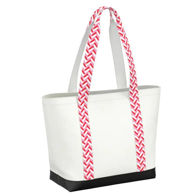 Lightweight zip-top shoulder bag with patterned handles and coated canvas finish. Ideal for travel, summer outings, or everyday use.