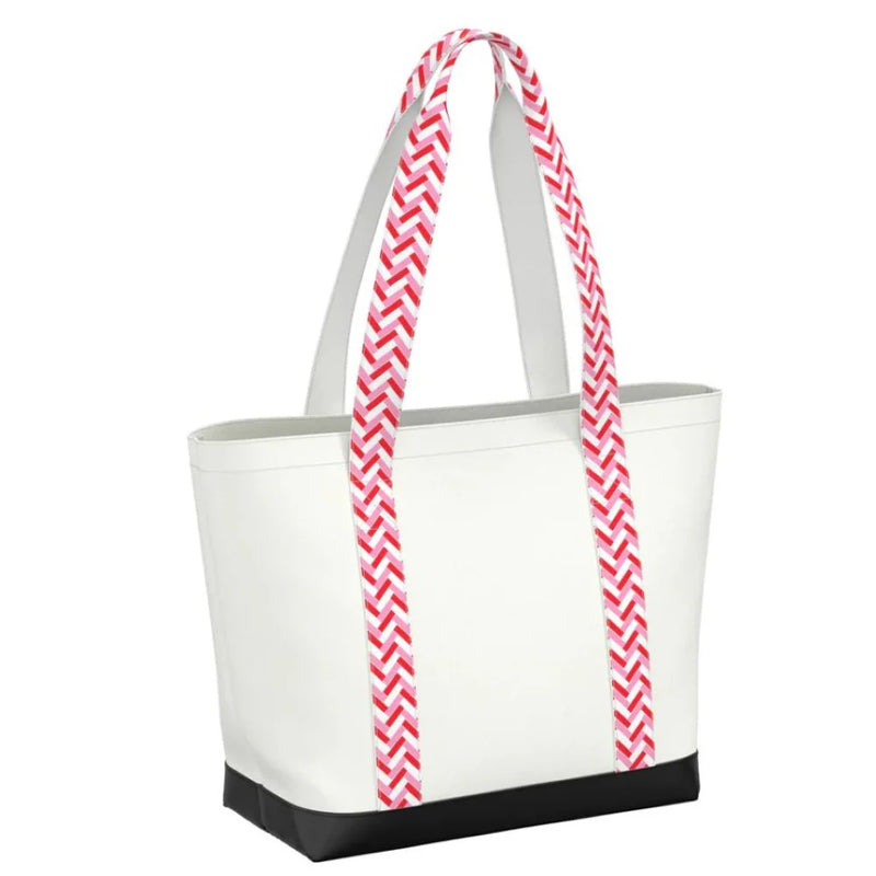 Lightweight zip-top shoulder bag with patterned handles and coated canvas finish. Ideal for travel, summer outings, or everyday use.