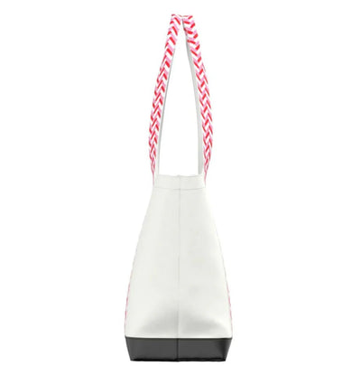 Lightweight zip-top shoulder bag with patterned handles and coated canvas finish. Ideal for travel, summer outings, or everyday use.