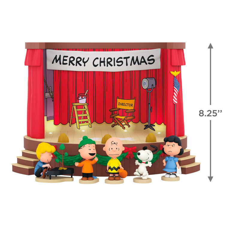 Peanuts tabletop Christmas decoration featuring Charlie Brown and friends on stage with lights and sound effects from A Charlie
