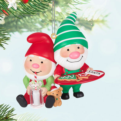 Hallmark Keepsake Gnome for Christmas ornament—two gnomes in red and green hats and overalls, with cookies for Santa and mug of milk, festive scene

