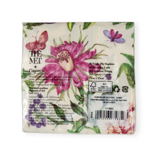Caspari Porcelain Blooms cocktail napkin in ivory with floral artwork, triple-ply and eco-friendly.