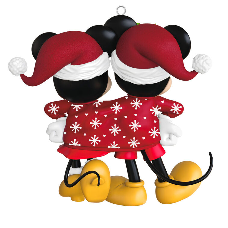 Mickey and Minnie wearing Santa hats and sharing a red Christmas sweater with snowflakes and hearts, Disney ornament.

