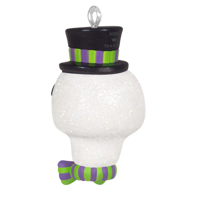 Mini Halloween skull ornament wearing sparkly top hat and bow tie with purple and green accents

