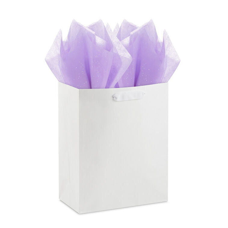 Hallmark amethyst tissue paper with iridescent dots, shown folded, styled in a gift bag, and displayed flat to highlight the shimmer.