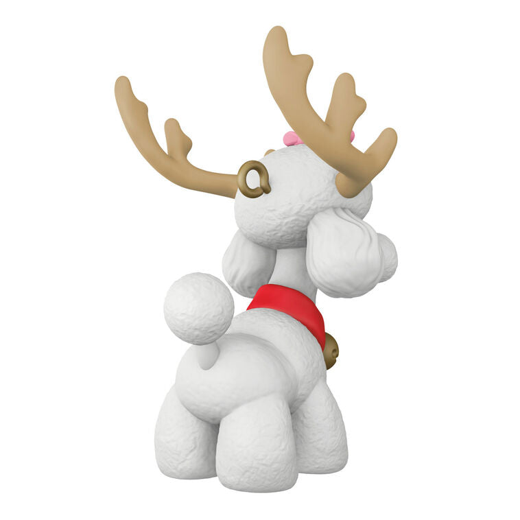 White poodle Christmas ornament wearing reindeer antlers and jingle bell collar, festive holiday decoration


