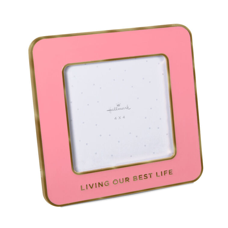 Bright pink enamel 4x4 picture frame with gold border and “Living our best life” caption, perfect for displaying special