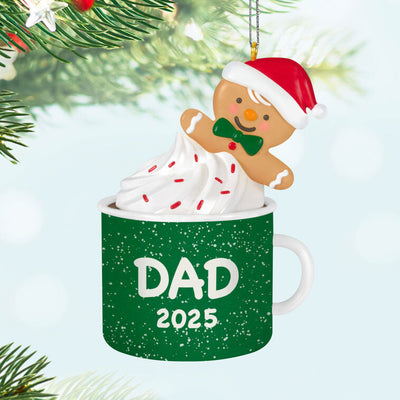 2025 Christmas ornament of gingerbread dad cookie in green mug with whipped cream, festive holiday design

