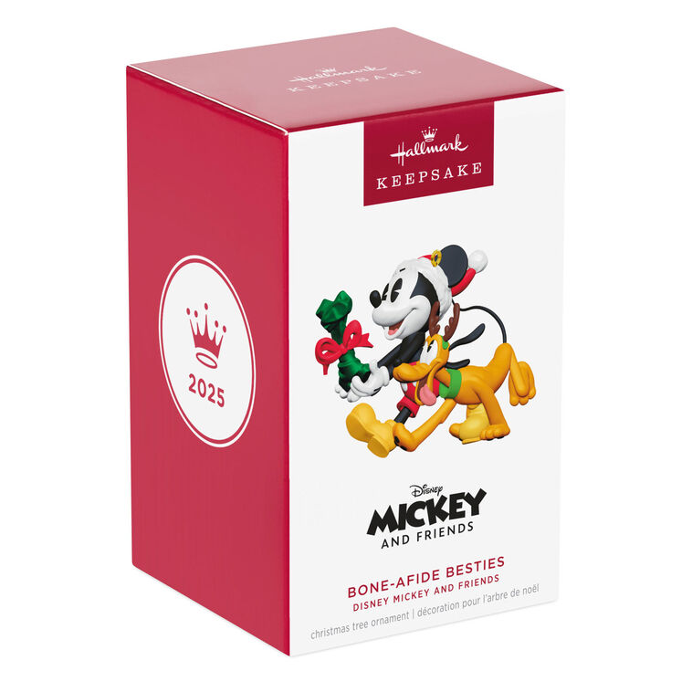 Mickey Mouse holding a dog bone gift walks beside Pluto in reindeer antlers in this cheerful Disney Hallmark Christmas ornament.