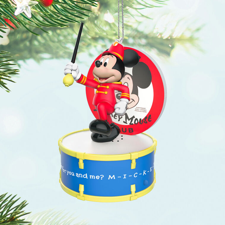 Mickey Mouse as bandleader in red outfit conducts with baton on drum stage in this musical Disney Christmas ornament with light.