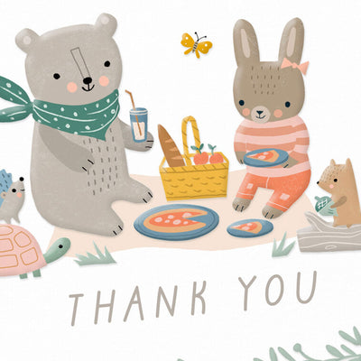 Baby thank you cards with bear and bunny picnic illustration framed by greenery, includes 10 blank white cards and kraft envelopes