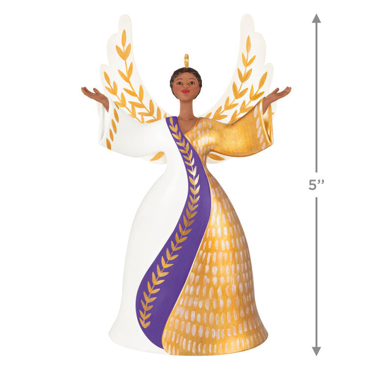 Angel ornament in gold, white, and purple gown with raised hands and detailed wings, a radiant Hallmark Keepsake holiday symbol of faith.