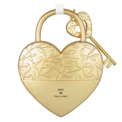Gold metal heart ornament with leaf-vine design and key, engraved with “Key to my heart” — a romantic gift for newlyweds or partners.