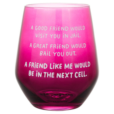 Dark berry-tinted stemless wine glass with white text: “A good friend would visit you in jail.