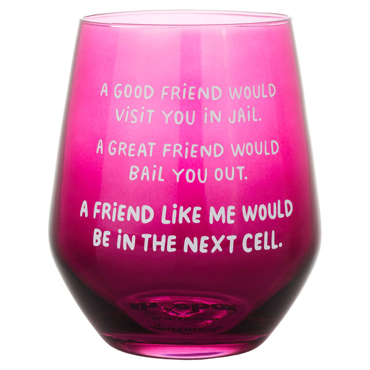 Dark berry-tinted stemless wine glass with white text: “A good friend would visit you in jail.