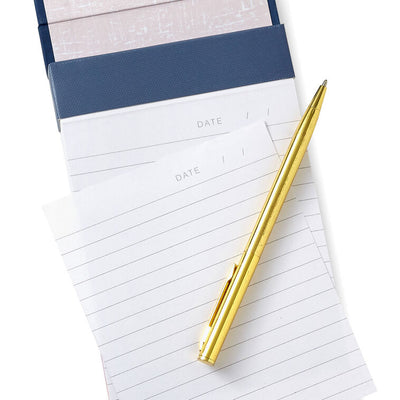 Small list pad with slate blue header and floral fabric cover featuring pink and white blossoms.
