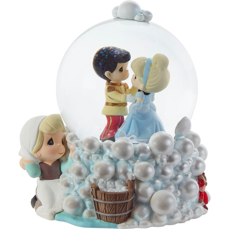 Precious Moments Cinderella musical snow globe with blue gown inside swirling glitter, plays “A Dream Is A Wish Your Heart Makes.”