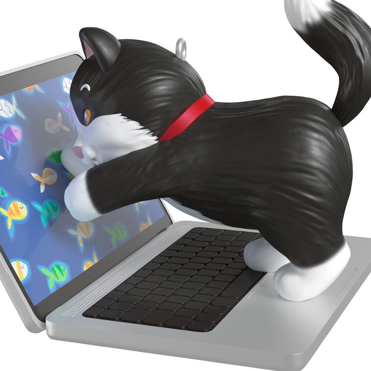 Hallmark Keepsake ornament of black-and-white tuxedo kitten playing with laptop showing colorful fish, Mischievous Kittens series