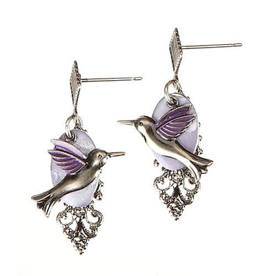 Silver-tone layered earrings with purple hummingbird and filigree detail, handcrafted design.
