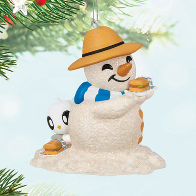 Hallmark Keepsake Sandal the Sandman ornament—sand snowman in Bermuda hat, blue and white scarf, with sub sandwich and sea turtle friend on the beach
