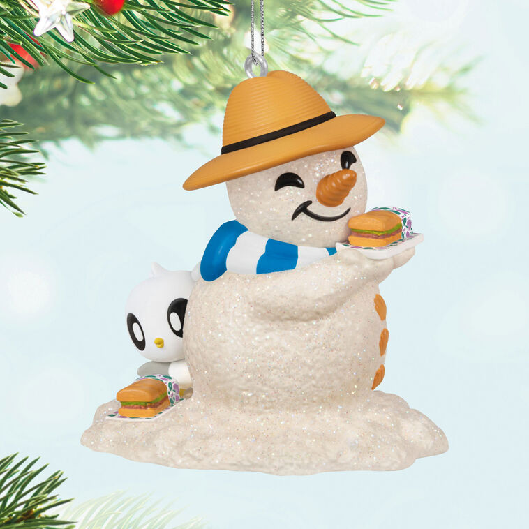Hallmark Keepsake Sandal the Sandman ornament—sand snowman in Bermuda hat, blue and white scarf, with sub sandwich and sea turtle friend on the beach
