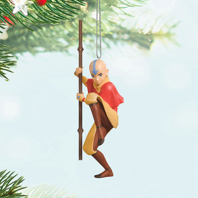Christmas ornament of Aang from Avatar: The Last Airbender holding his staff in a defensive pose with arrow tattoo on forehead.