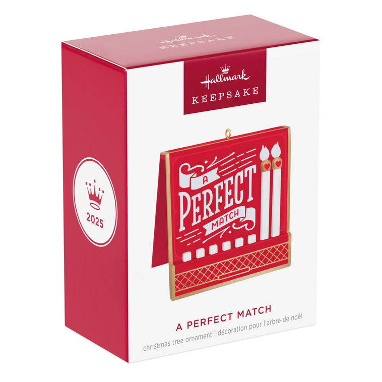 Red and gold matchbook-style ornament with “A Perfect Match” lettering and two heart-accented matchsticks
