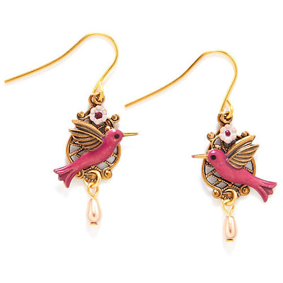 Gold-tone drop earrings with pink hummingbird, floral filigree, and colored bead.
