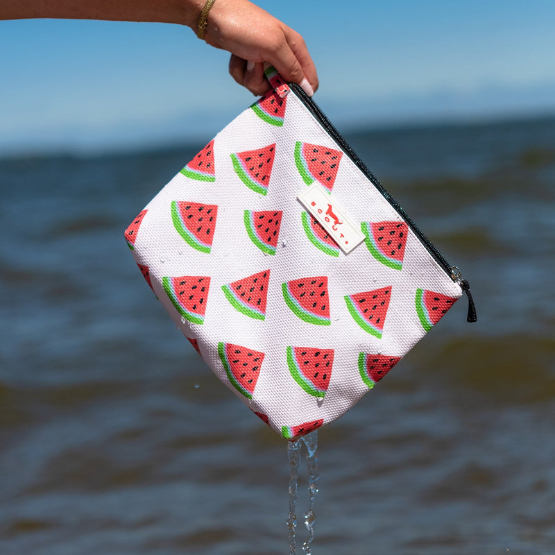 SCOUT Go Getter Woven Pouch in One in a Melon with breathable fabric, zip top, and upright flat bottom for easy packing and beach use.