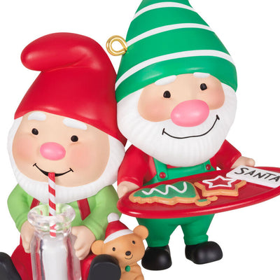 Hallmark Keepsake Gnome for Christmas ornament—two gnomes in red and green hats and overalls, with cookies for Santa and mug of milk, festive scene
