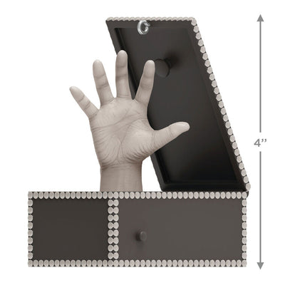 Musical ornament of Thing hand in box from The Addams Family TV show, plays theme song when button is pressed