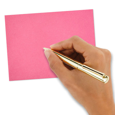 Bright pink envelopes with gold and white halftone dot design inside the flap and pointed edges.
