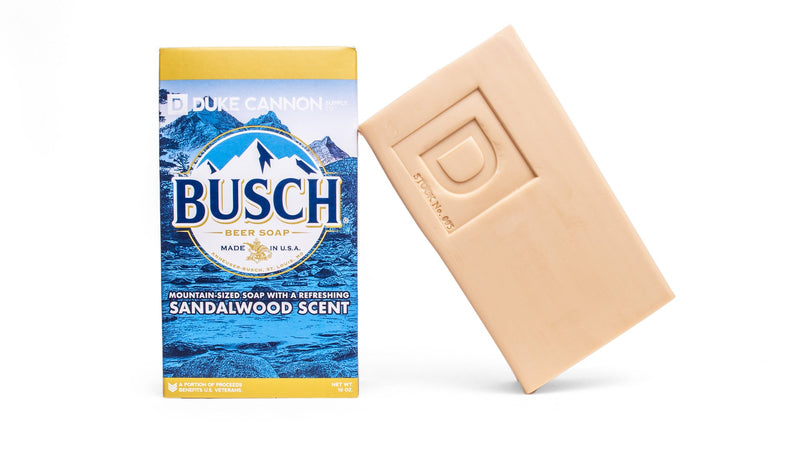 Duke Cannon Big Ass Brick Soap (Sandalwood) next to Busch beer box