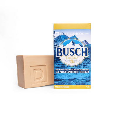Duke Cannon Big Ass Brick Soap (Sandalwood) next to Busch beer box
