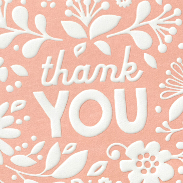 Coral thank-you cards with white embossed floral designs, shown with matching envelopes and presented in a gray gift box.
